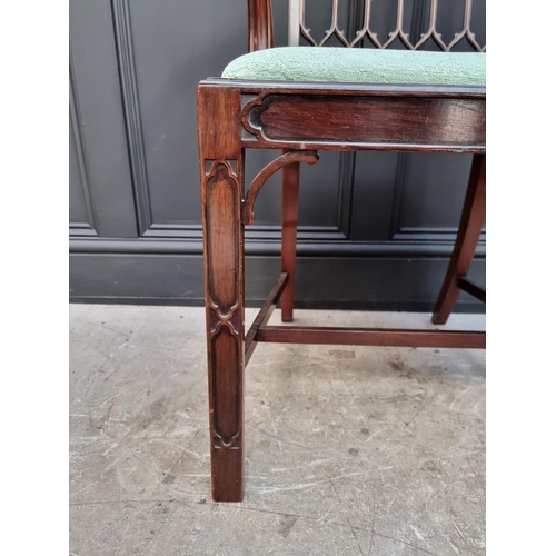 1076 - A late 19th/early 20th century Gothic style mahogany elbow chair; together with another mahogan... 