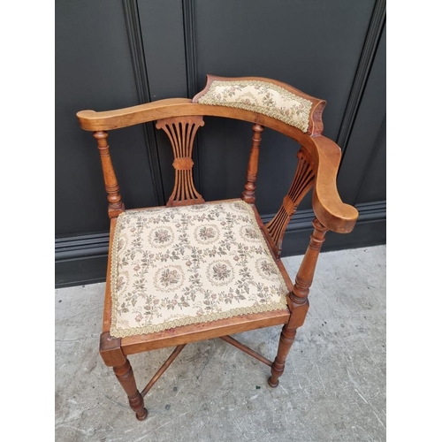 1076 - A late 19th/early 20th century Gothic style mahogany elbow chair; together with another mahogan... 