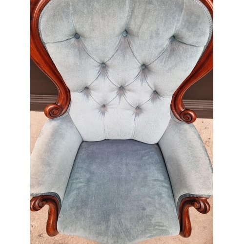 1082 - A Victorian mahogany and button upholstered occasional armchair. 