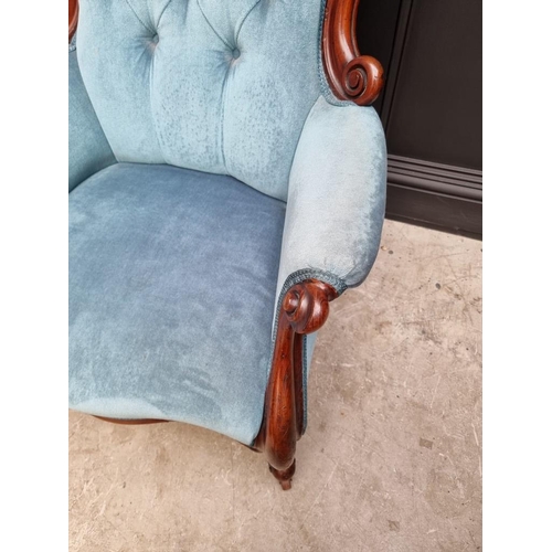 1082 - A Victorian mahogany and button upholstered occasional armchair. 