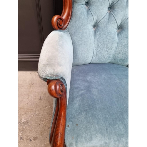 1082 - A Victorian mahogany and button upholstered occasional armchair. 