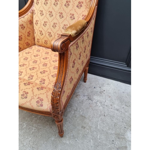 1085 - A Louis XVI style carved beech fauteuil. 