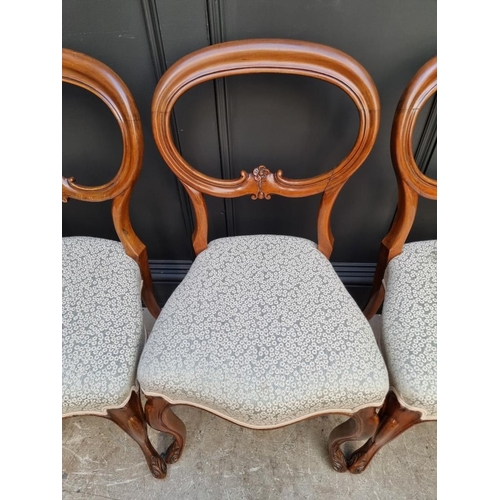 1087 - A set of four Victorian walnut balloon back dining chairs.  