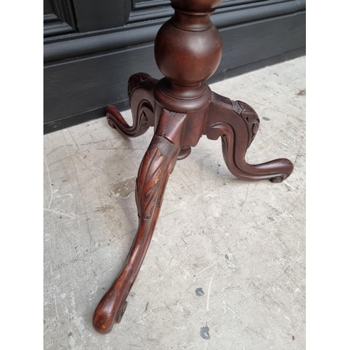 1095 - A carved walnut and specimen marble octagonal tripod table, 38cm wide. 