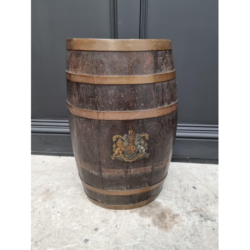 1096 - A coopered oak barrel stick stand, emblazoned with The Royal Standard, 59cm high.