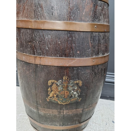 1096 - A coopered oak barrel stick stand, emblazoned with The Royal Standard, 59cm high.