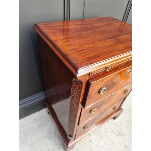 1097 - A small antique mahogany three drawer chest, with brushing slide, 57.5cm wide, (alterations).... 