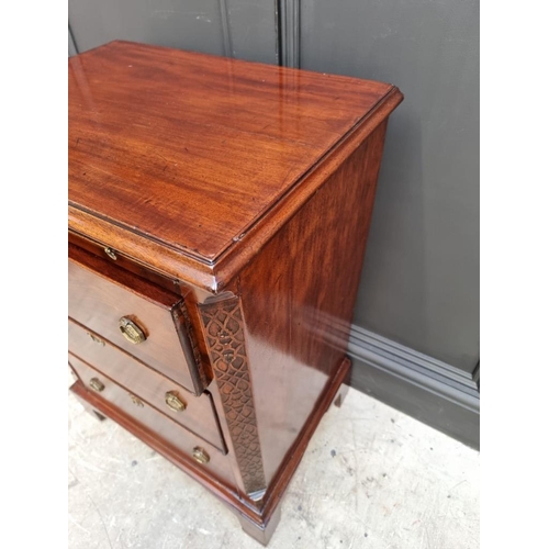 1097 - A small antique mahogany three drawer chest, with brushing slide, 57.5cm wide, (alterations).... 