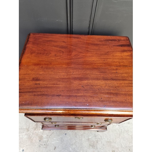 1097 - A small antique mahogany three drawer chest, with brushing slide, 57.5cm wide, (alterations).... 