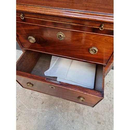 1097 - A small antique mahogany three drawer chest, with brushing slide, 57.5cm wide, (alterations).... 