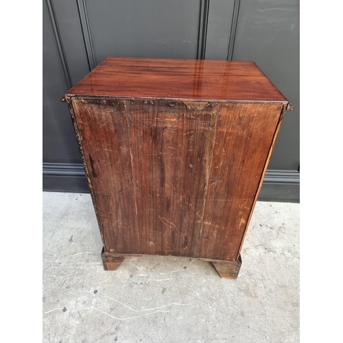 1097 - A small antique mahogany three drawer chest, with brushing slide, 57.5cm wide, (alterations).... 