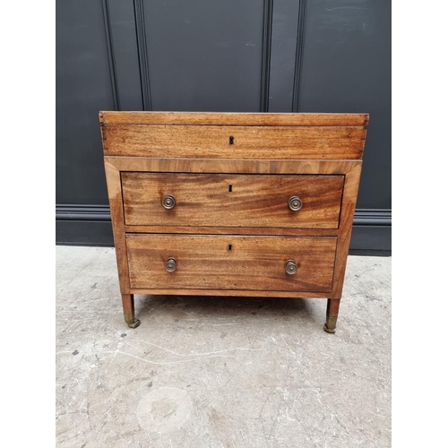 1099 - A small antique mahogany two drawer chest, with hinged top, 61cm wide, (alterations).... 