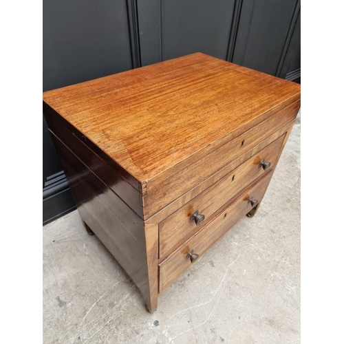 1099 - A small antique mahogany two drawer chest, with hinged top, 61cm wide, (alterations).... 