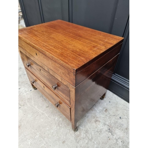 1099 - A small antique mahogany two drawer chest, with hinged top, 61cm wide, (alterations).... 