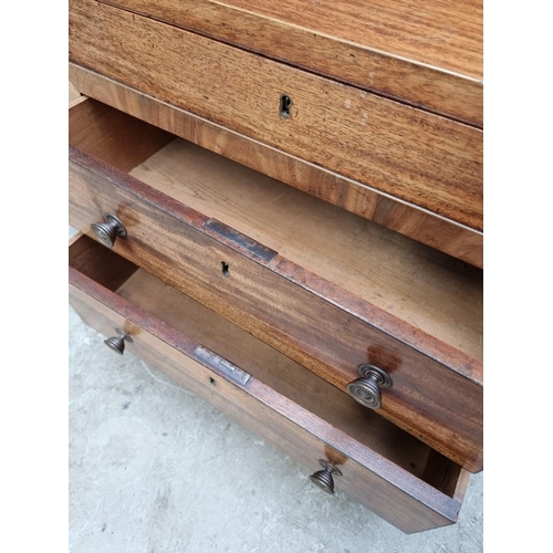 1099 - A small antique mahogany two drawer chest, with hinged top, 61cm wide, (alterations).... 