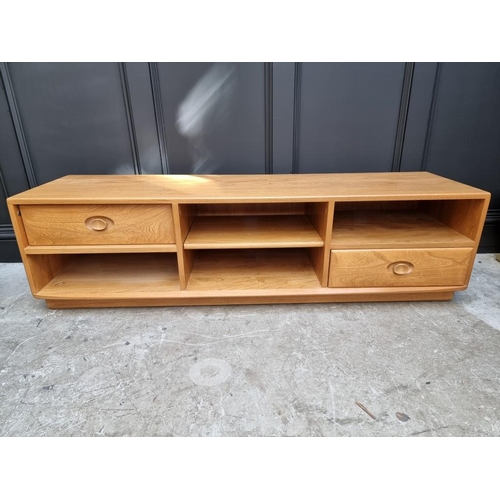 1100 - An Ercol television or media stand, 155cm wide.