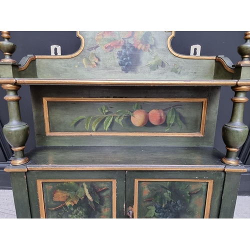 1102 - An antique green painted and parcel gilt hanging wall cabinet, painted with fruit, 61.5cm wide.... 