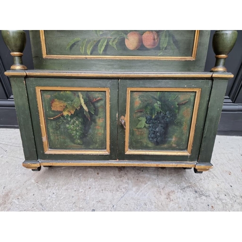 1102 - An antique green painted and parcel gilt hanging wall cabinet, painted with fruit, 61.5cm wide.... 