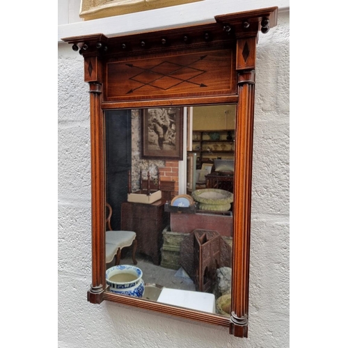 1103 - A Regency mahogany and line inlaid pier mirror, 68.5 x 50cm.