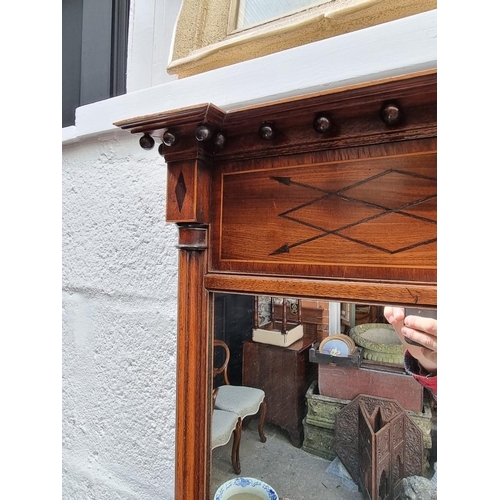 1103 - A Regency mahogany and line inlaid pier mirror, 68.5 x 50cm.