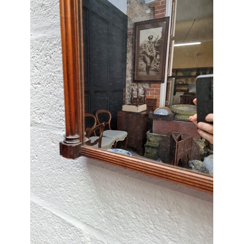 1103 - A Regency mahogany and line inlaid pier mirror, 68.5 x 50cm.