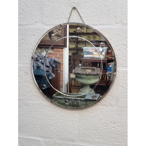 1109 - An Art Deco circular wall mirror, 50.5cm diameter.