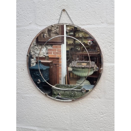 1109 - An Art Deco circular wall mirror, 50.5cm diameter.