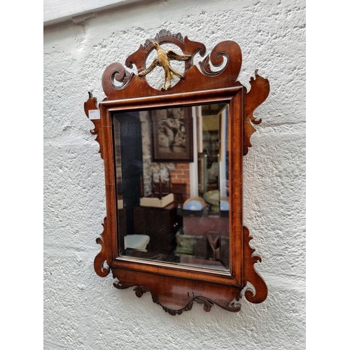 1121 - WITHDRAWN: a small 18th century walnut fret framed mirror, 48.5 x 31.5cm.