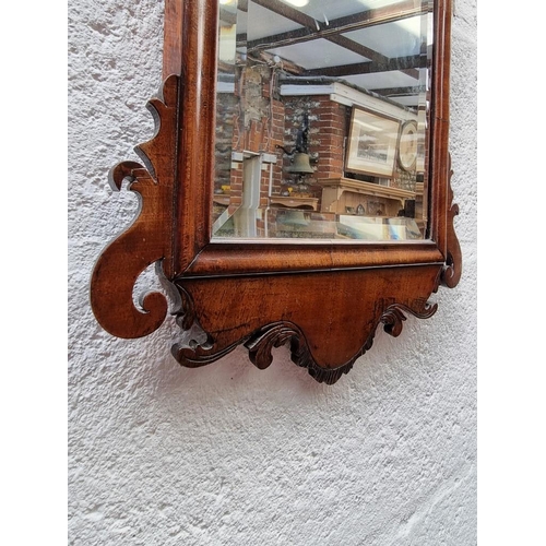 1121 - WITHDRAWN: a small 18th century walnut fret framed mirror, 48.5 x 31.5cm.