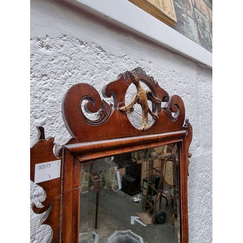 1121 - WITHDRAWN: a small 18th century walnut fret framed mirror, 48.5 x 31.5cm.