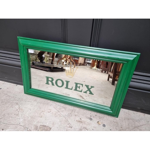 1132 - A Rolex style rectangular wall mirror, 30 x 51.5cm. 