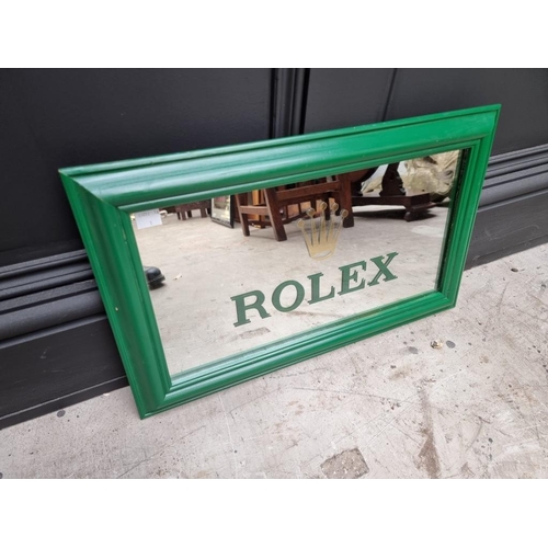 1132 - A Rolex style rectangular wall mirror, 30 x 51.5cm. 