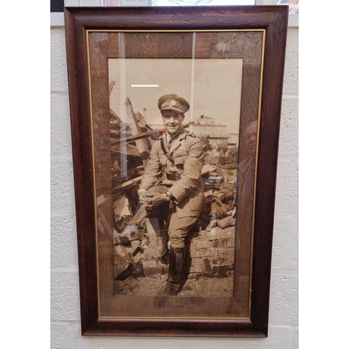 1135 - A large monochrome print of a World War I army officer, 91 x 48cm.