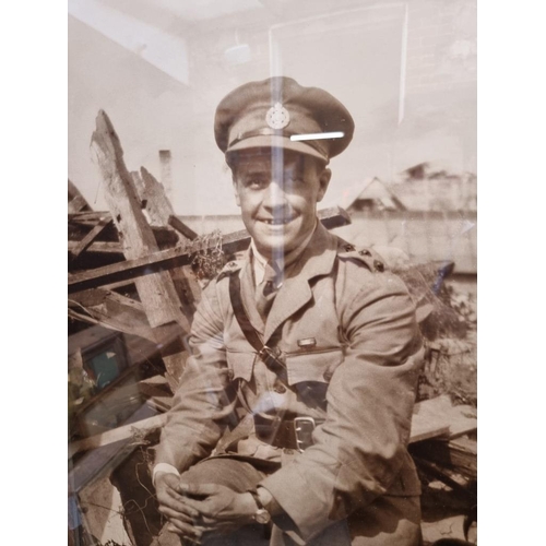 1135 - A large monochrome print of a World War I army officer, 91 x 48cm.