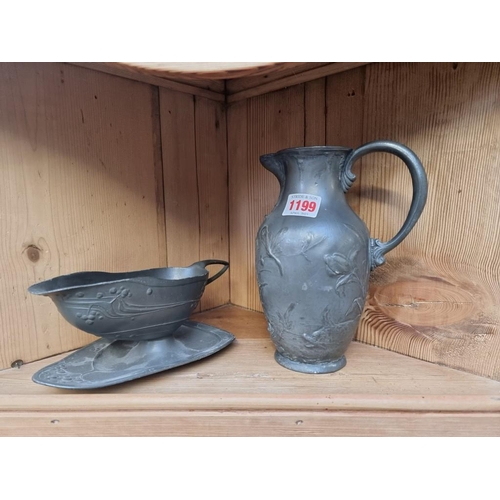 1199 - A WMF Art Nouveau pewter jug, 20cm high; together with another Secessionist pewter sauceboat. (... 