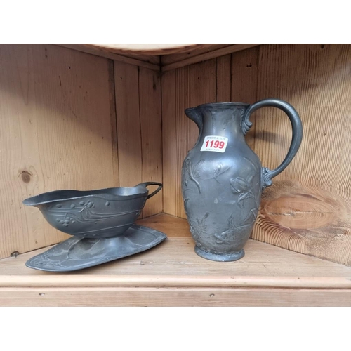 1199 - A WMF Art Nouveau pewter jug, 20cm high; together with another Secessionist pewter sauceboat. (... 