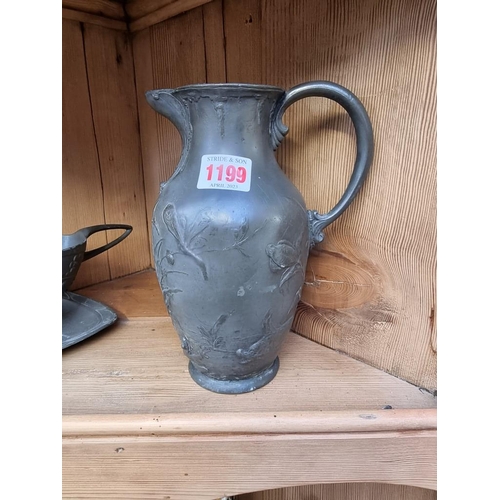 1199 - A WMF Art Nouveau pewter jug, 20cm high; together with another Secessionist pewter sauceboat. (... 