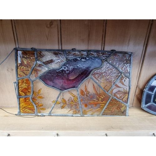 1202 - Three old stained and leaded glass panels, largest 38 x 23cm; together with an acrylic advertising s... 