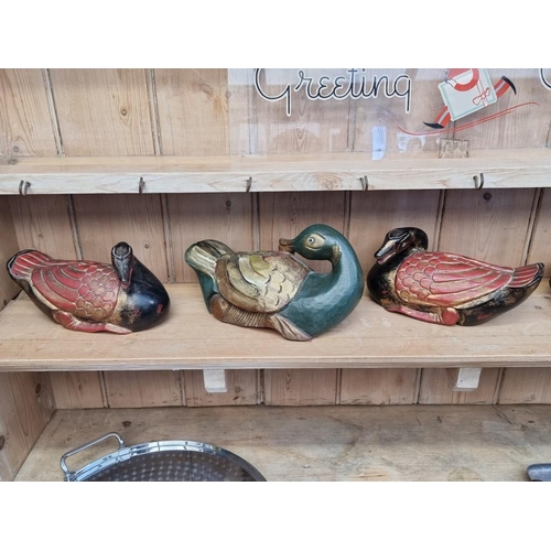 1203 - A mixed group of Chinese items, to include three polychrome painted carved wood geese, largest 25.5c... 