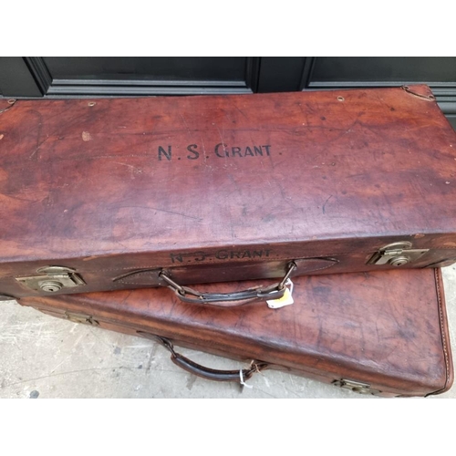 1220 - Two vintage tan leather cases, largest 77cm wide.  