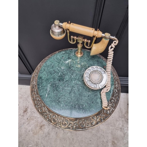 1226 - A vintage brass and green marble telephone table. (a.f.)  