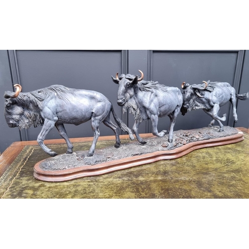 1234 - Tim Nicklin, 'Wildebeast Migration', bronzed resin, 109cm long, with certificate, (s.d.).... 