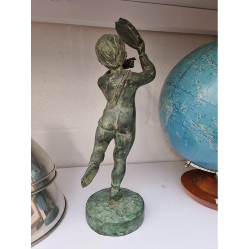 1236 - A pottery figure of a cherub with tambourine, with verdigris surface, 43cm high.... 