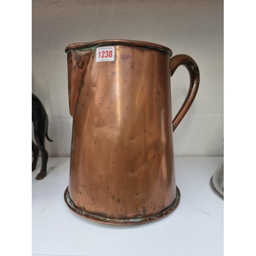 1238 - A Victorian copper jug, with coronet and monogram, 28.5cm high. 