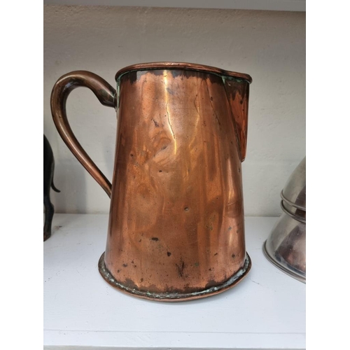 1238 - A Victorian copper jug, with coronet and monogram, 28.5cm high. 