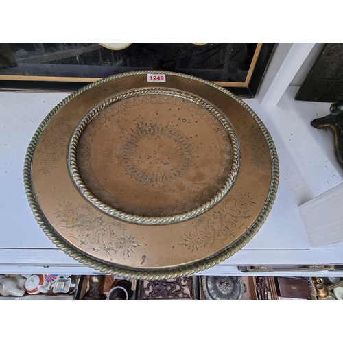 1249 - A Victorian brass pedestal dish, with engraved decoration, 32.5cm diameter.