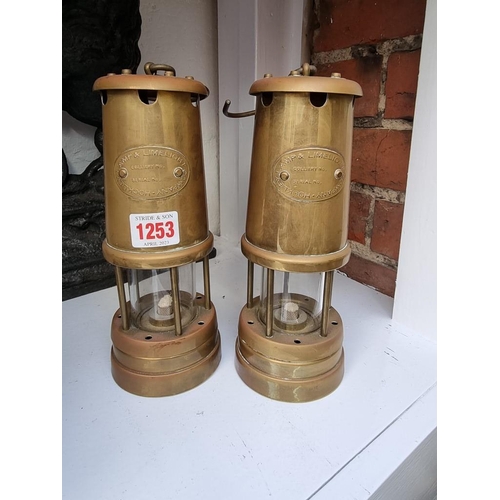 1253 - Two brass miner's lamps.  