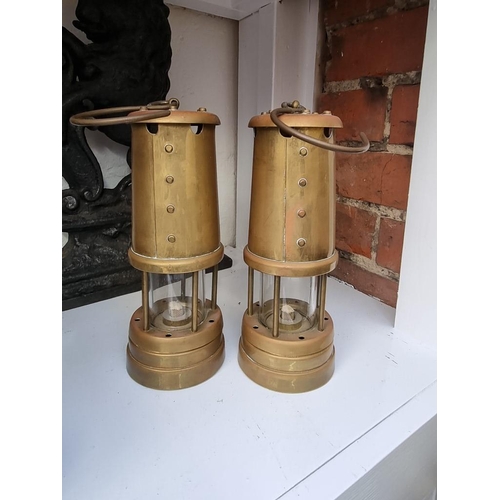 1253 - Two brass miner's lamps.  