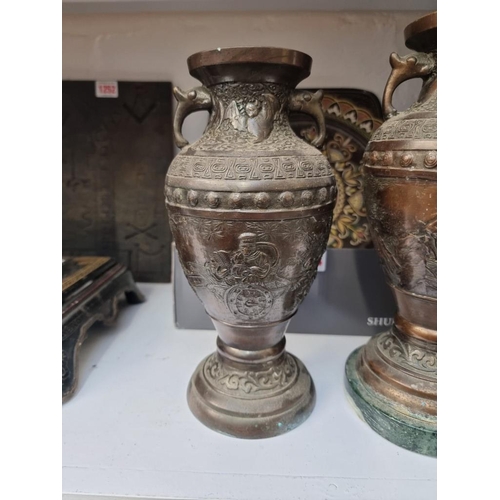 1262 - A mixed group of Oriental items, to include: a pair of Japanese bronze vases; two Chinese cork diora... 