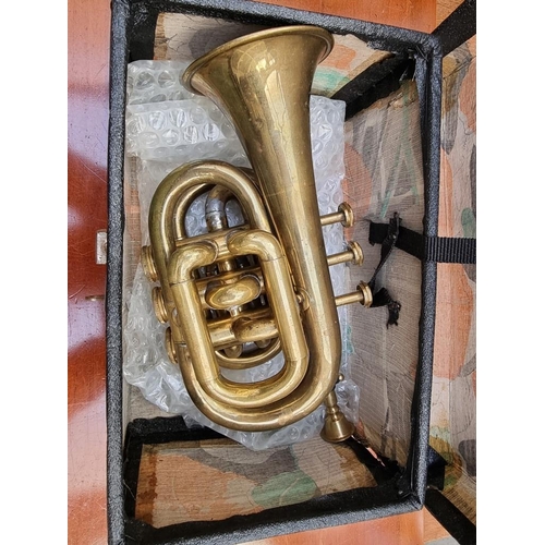 1263 - A vintage Boosey 'Heley' brass pocket or piccolo cornet, in case.